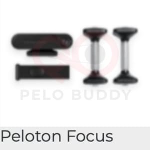 Image of the Peloton Focus strength device. Shown with weights and a resistance band.