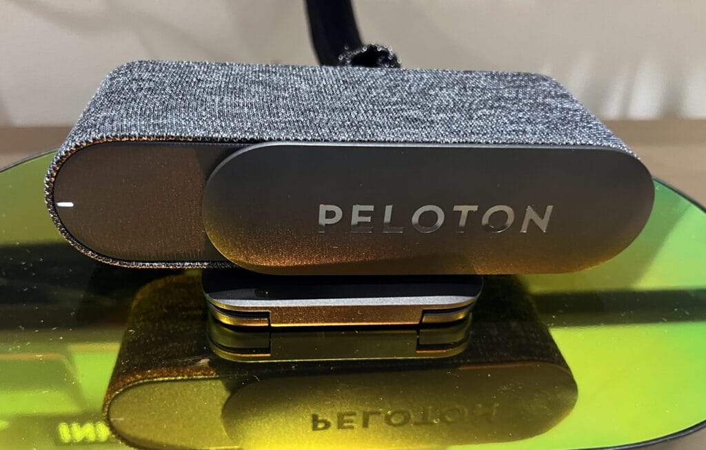 Here, the Peloton Guide mount is sitting flat on a shelf.