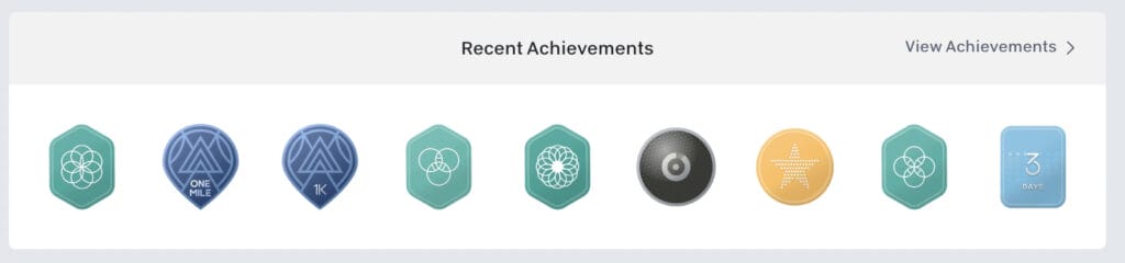 1K & 1 Mile badges showing in recent achievements on a Profile.