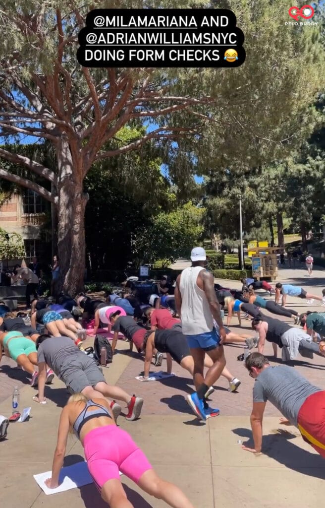 Adrian Williams supervising planks during the group workout at Peloton on Tour.