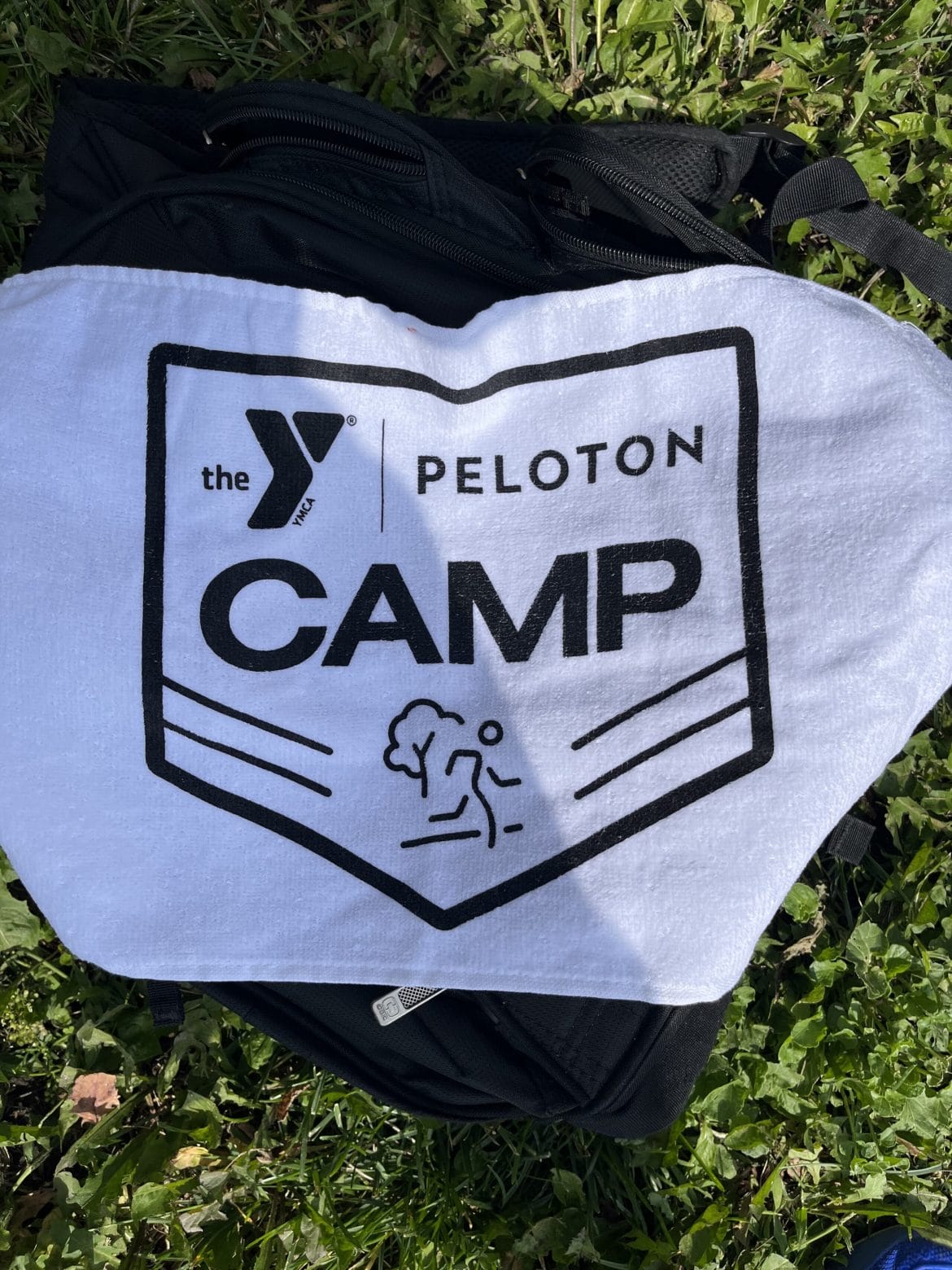 Peloton x YMCA Adult Day Camp swag.