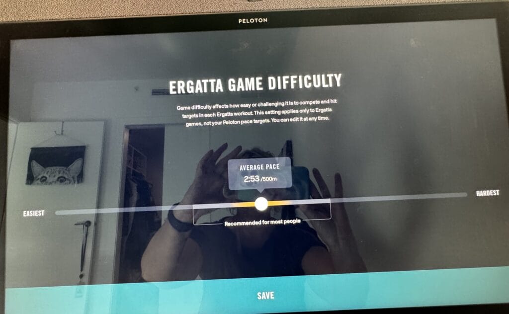 Setting the difficulty level on an Ergatta video game on Peloton Row. 